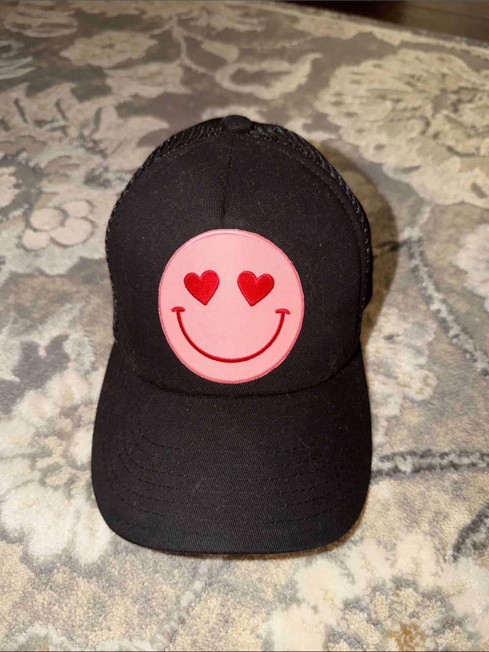 Lulu's Black Trucker Cap with Pink Heart-Eyes Smiley Patch
